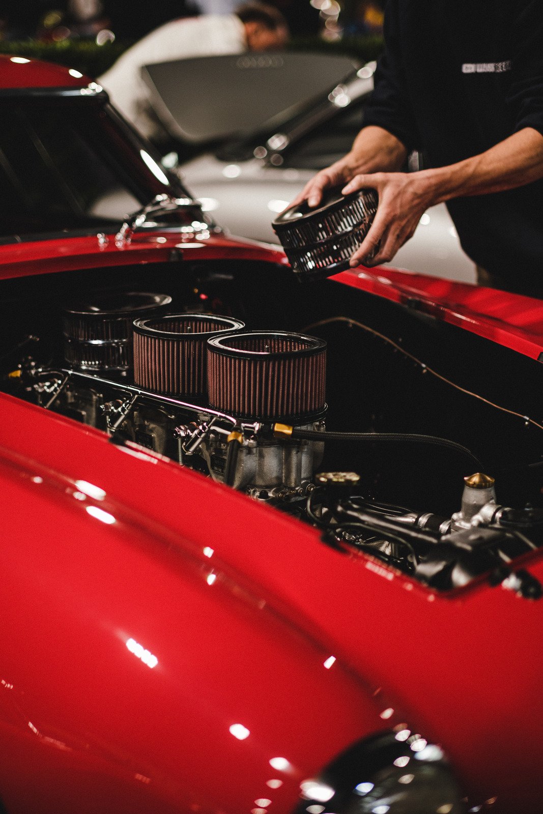 Mechanic working on car engine